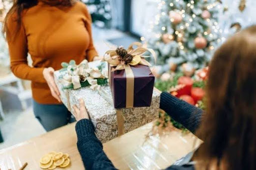 Entrepreneur Presenting End of the Year Gift to Client